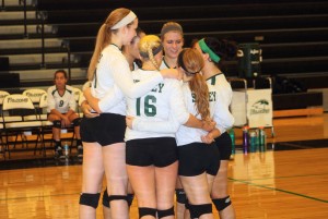 After they score a point, varsity volleyball players huddle up to celebrate. On Sept. 12, Staley played Raytown High School and won the match. "Just doing something that I love," said No. 16, junior Katie Flynn.