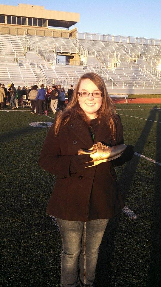 Katelyn Watson holds her Golden Shoe award after the competition Oct. 24.
