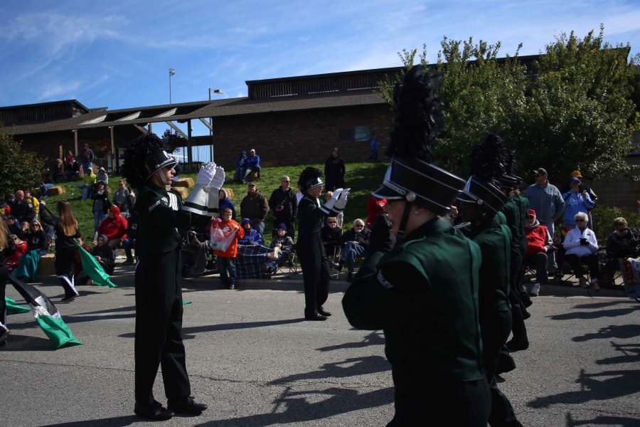 At the Gladfest parade, freshman Alex Greg marches with the band. The Falcon Brigade marched in the parade on Oct 4. “There were a lot of kids that said they wanted to be in band when they were older” Greg said.