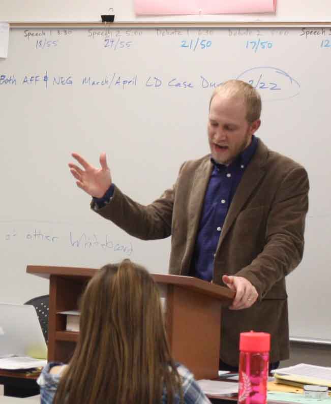 Speech+and+Debate+coach+Shiloh+Dutton+teaches+novice+debate+on+Feb+16.+He+said+that+he+has+a+strong+passion+for+teaching+debate+because+of+the+skills+students+are+taught.+I+value+teaching+debate+because+the+skills+in+the+knowledge+acquired+in+a+debate+class+can+immediately+be+utilized+outside+of+the+class+room.+