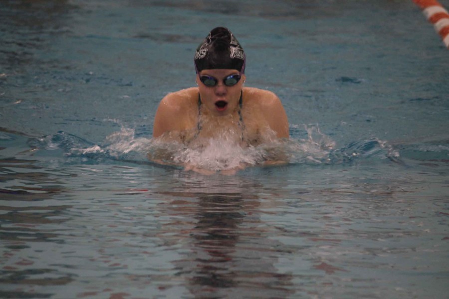 On Dec. 8, sophomore Rachel Janiak swims the 200 IM at the Platte County Community Center. This is her second year on the swim team, and she has made it to state both years. “Every meet helps me get closer to what I want to become as a swimmer,” said Janiak. 
