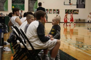 Cancer Patient Rhylan Lopata, 5, who is currently undergoing chemo therapy, sat the bench with the Varsity Basketball Team on February 2 in which they won against Fort Osage 71-52 at the Falcon Fieldhouse.  The team named him and his brother honorary coach for the night. “It made me feel good to help someone so young going through something so hard,” said sophomore varsity player Bennett Holloway, “It was really inspiring to watch him go through something like cancer and help him through that.” 
