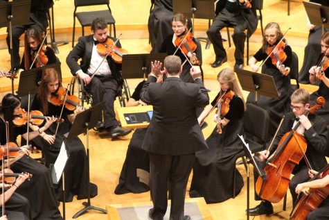 Junior Emily Beahm performs with the symphonic orchestra on Feb. 8 at the Kauffman Center for the Performing Arts. The orchestra performed as a part of the first annual William Jewel Festival of Strings. “I thought that it was really exciting to play there because the sound was very different from anywhere we’d played before,” Beahm said. “It was a unique experience for all of us.”