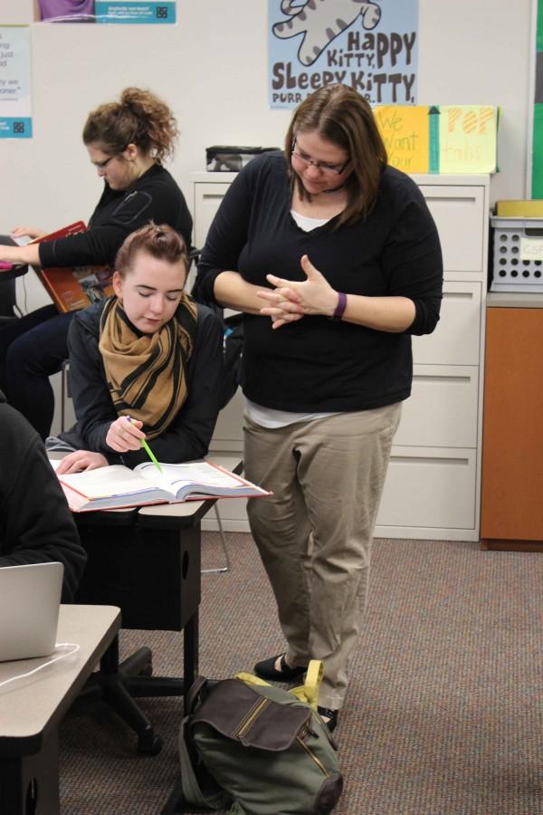 Martin helps senior Hannah White during her Accounting class. Martin earned an award for her commitment to young womens aspirations in computing. It means a lot to me, said Martin. 