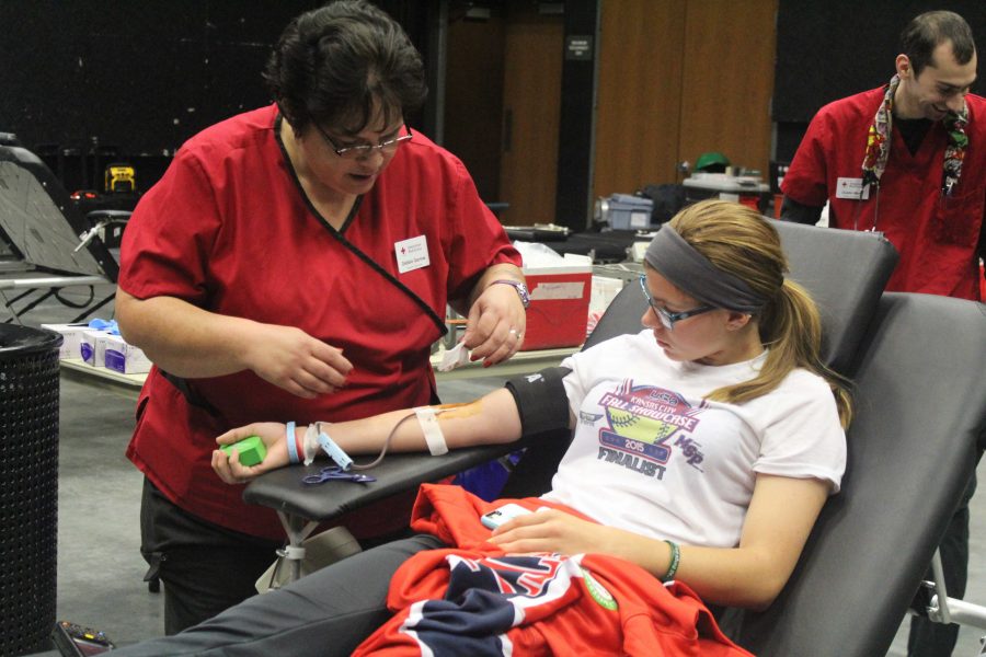 During the biannual American Red Cross blood drive on Nov. 16 in the Flex Auditorium, senior Erica Woolery gets her blood drawn. She said it was her sixteenth time donating blood. “The needle doesn’t scare me as much anymore since I’m used to the whole donating process,” said Woolery.

