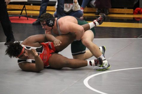 In the last match of a dual, junior Dan Mangold is going up against a Park Hill High
School opponent in the fieldhouse. Mangold ended up winning the match in double
overtime. “That match was big for districts team,” said Mangold.