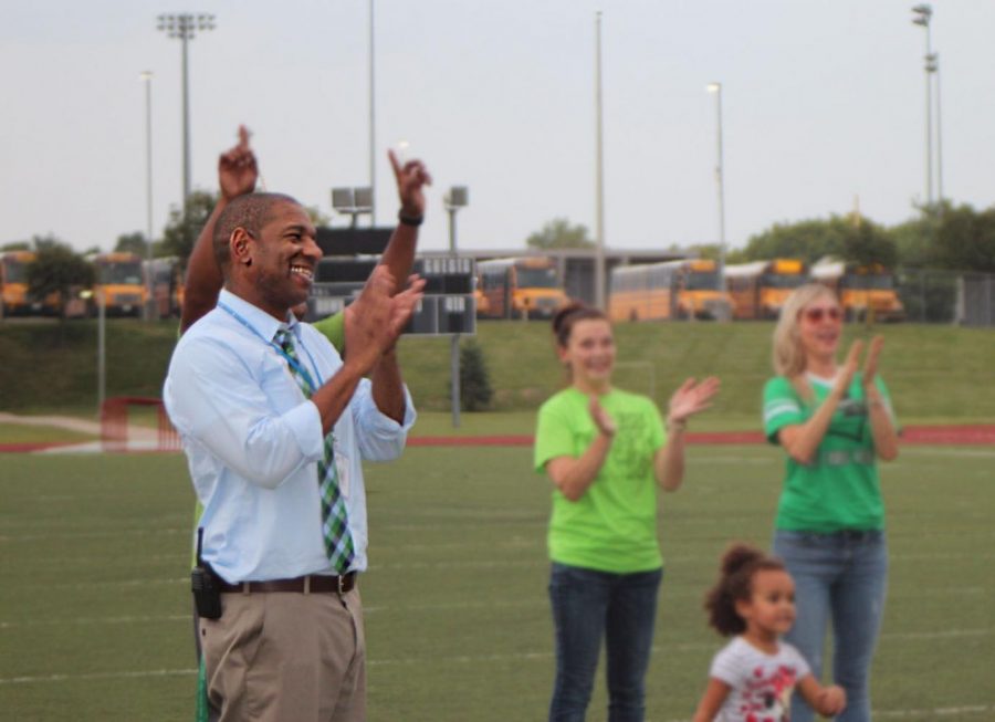In preparation for homecoming, principal Larry Smith claps at the homecoming pep rally Oct. 20. Smith tried to attend as many extracurricular events and get involved with the school as much as possible. “Just being a part
of the Staley family is what I’m looking forward to the most,” said Smith.