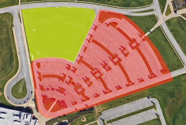 Graphic of the current school parking lot (red), and the proposed expansion area (yellow).