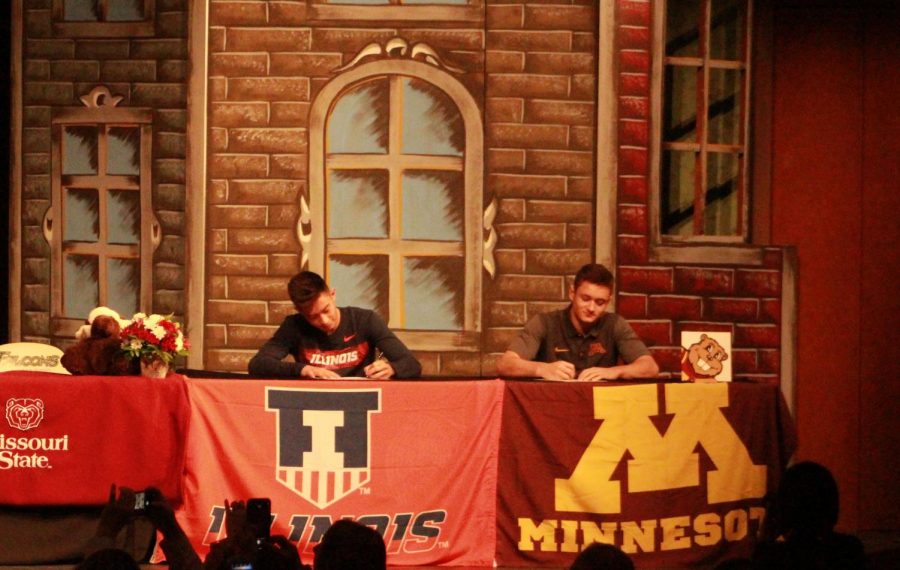 Highly ranked gymnasts’ seniors Victor Perez and Evan Manivong sign their letters of intent on Nov. 14 in the Performing Arts Center. Manivong signed to the University of Illinois and Perez signed to the University of Minnesota. “I was happy that it was finally signing day. I had been waiting for that moment for a while,” said Manivong. Photo by Lexi Valdez