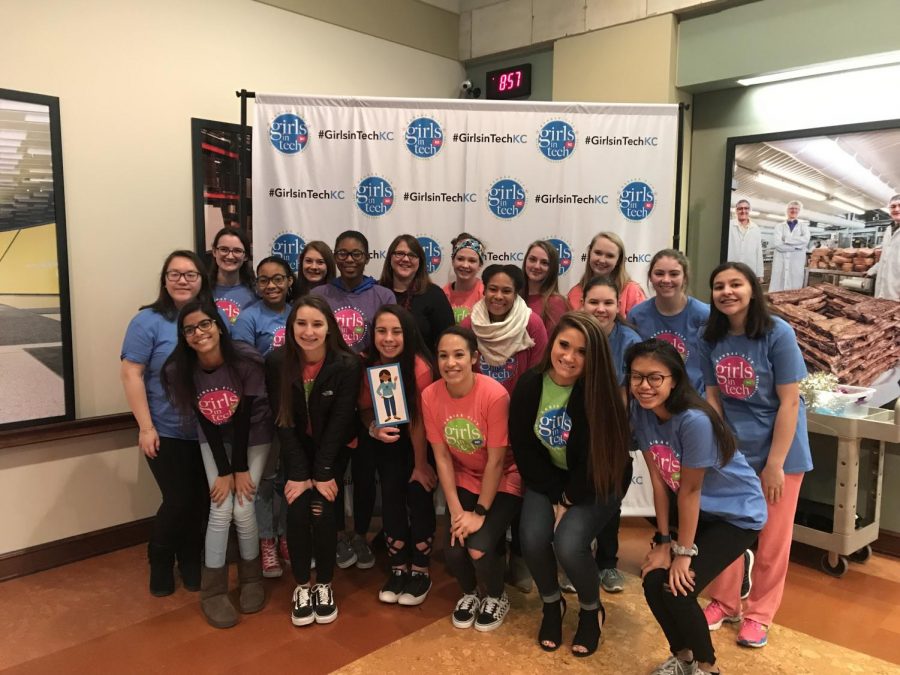 Girls from Staley pose in front the “#GirlsInTechKC” wall wearing T-shirts from the event. “I’m so glad that we went, it was a great experience,” says sophomore Sophia Jordan. The eighteen girls, all from different grades, worked alongside each other throughout the day. 