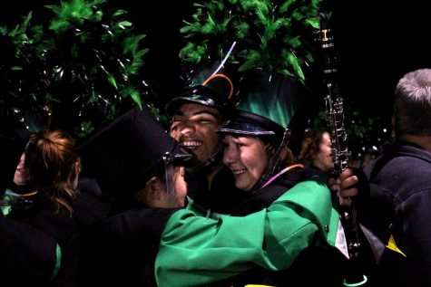 senior band members Demetrius Cassaway, Sydney Peck and junior Kiyoko Nakano