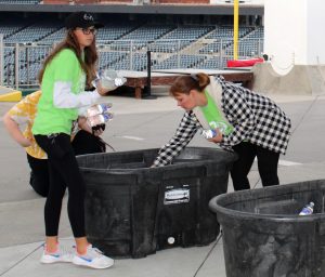 File Photo: For participants of the ALS walk, junior Kate Hanchette and NHS club sponsor Carol Toney distribute water bottles among bins. Toney decided to participate in the walk because she wanted to help a cause that connects to her personally. “My brother-in-law was diagnosed with ALS in 2013, so he has been battling ALS for the past eight and a half years. ALS is central to our family because my husband is also a caregiver for him,” Toney said.