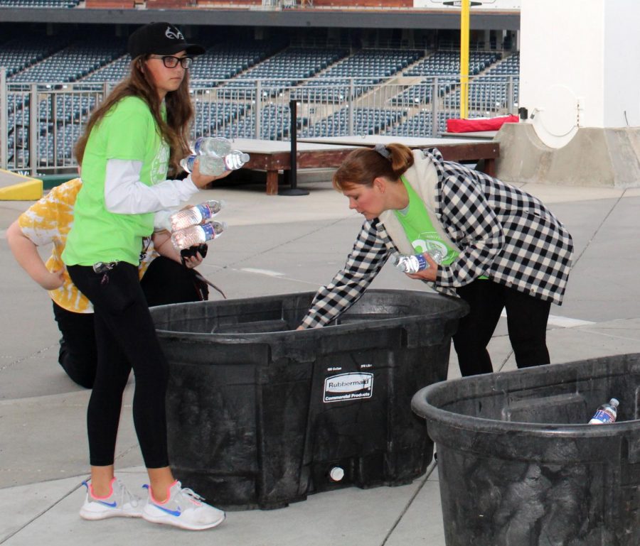 For participants of the ALS walk, junior Kate Hanchette and NHS club sponsor Carol Toney distribute water bottles among bins. Toney decided to participate in the walk because she wanted to help a cause that connects to her personally. “My brother-in-law was diagnosed with ALS in 2013, so he has been battling ALS for the past eight and a half years. ALS is central to our family because my husband is also a caregiver for him,” Toney said.
