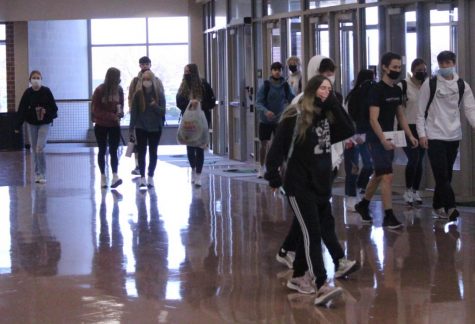 Students enter the school building Thursday, Dec. 9, a late start day. Administrators said the tardy rate for Thursdays has increased.