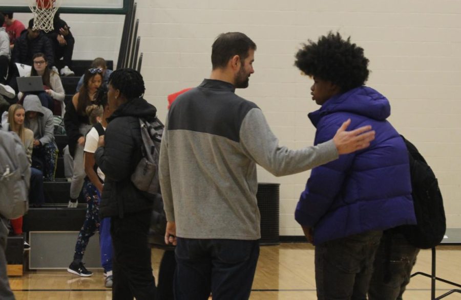 Coach David Fowler works with athletes interested in track and field during a WIN Time meeting Dec. 14.