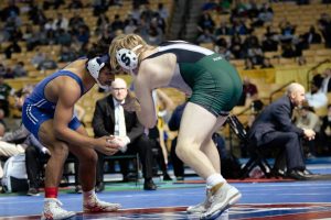 File Photo: Coach Elisha Bears coaches Merrik Murray during a wrestling match.