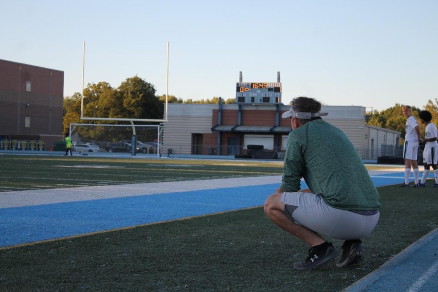 During the Sept. 29 game against Grandview High School, coach Johnny Chain watches the field. Varsity won 2-1.