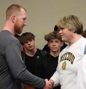 Football players meet the new head coach Drew Hudgins during WIN Time Feb. 29.