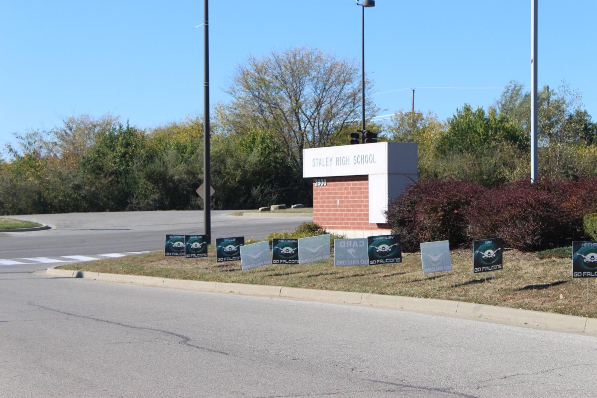 Senior signs in front of 'Staley High School'