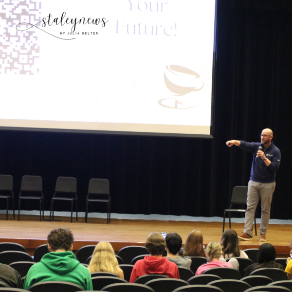 Class Act teacher Zachary Johnson talks to students Nov. 15 about the student-led coffee shop.