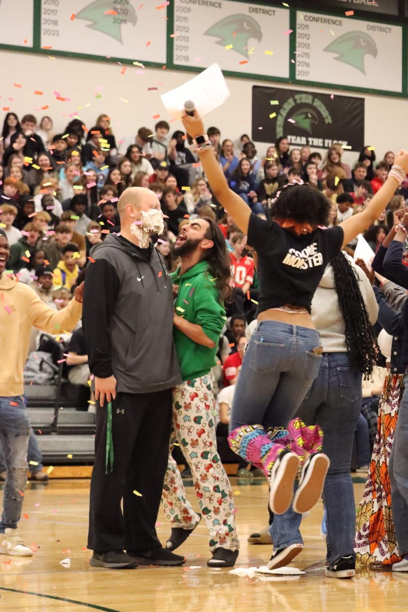 At the Diversity Assembly Nov. 22, senior Gideon Samuel laughs after social studies teacher Josh Lorenson was pied in the face by another student.