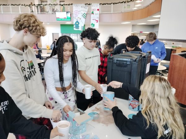 Students get hot chocolate during StuCo's hot cocoa day Dec. 9, 2024.