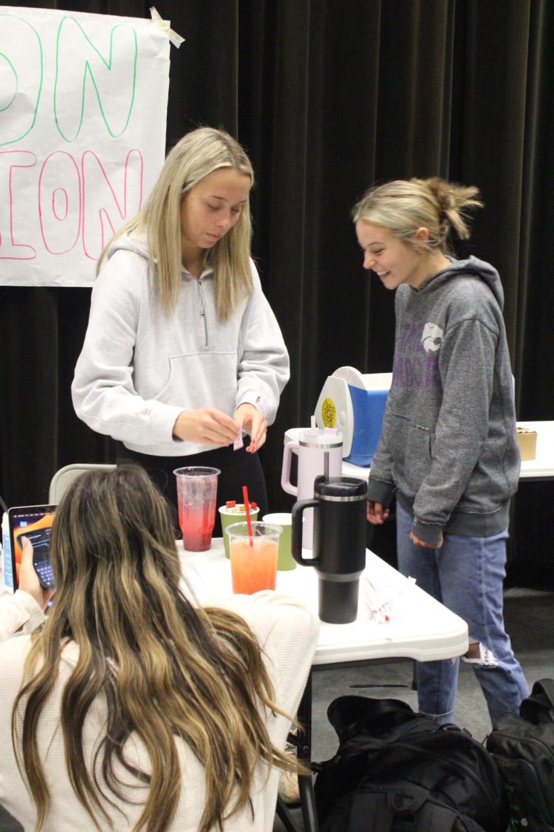 At Market Day Dec. 7, 2023, then-juniors Cara Elam and Santanna Jordan are at the table selling drinks. 