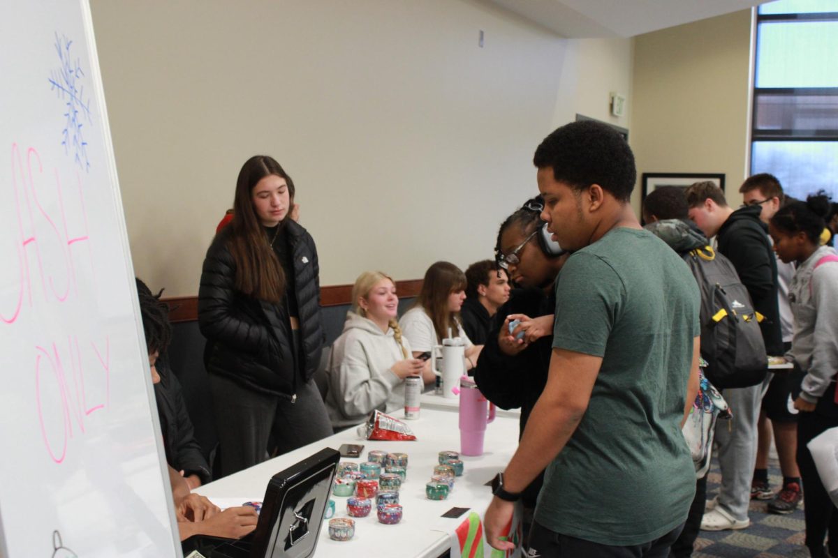 Entrepreneurship students work at the Falcon Fair Dec. 12.