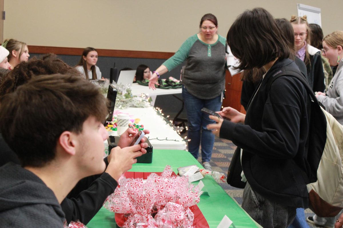 Entrepreneurship students work at the Falcon Fair Dec. 12.