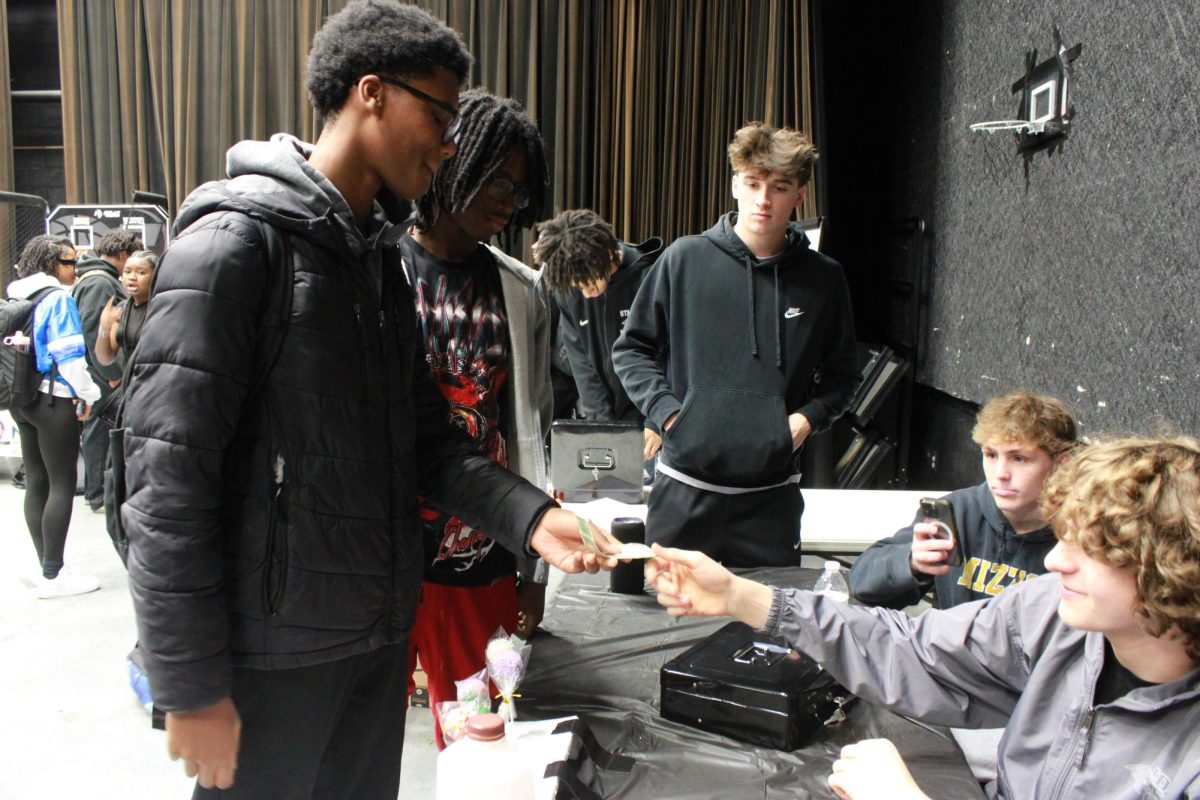 Entrepreneurship students work at the Falcon Fair Dec. 12.