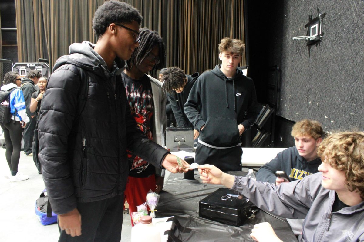 Entrepreneurship students work at the Falcon Fair Dec. 12.