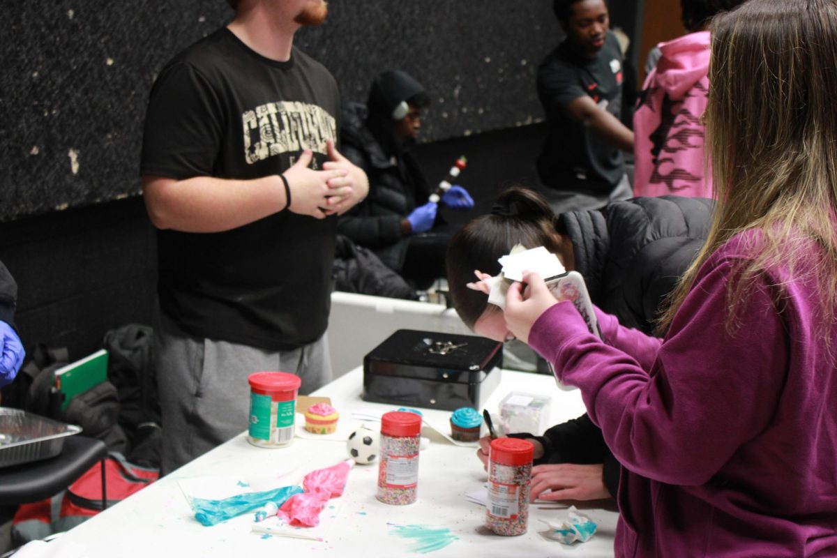 Entrepreneurship students work at the Falcon Fair Dec. 12.