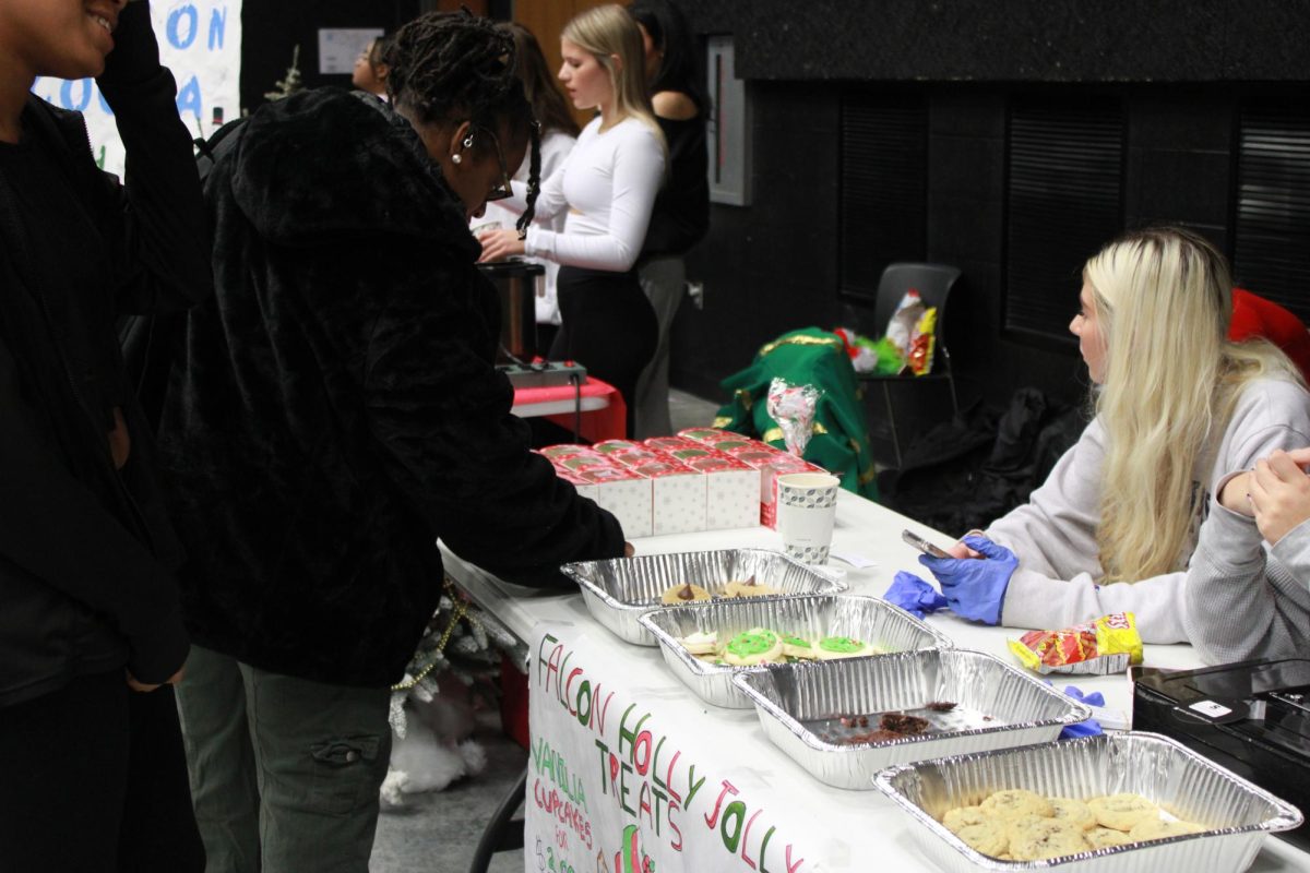 Entrepreneurship students work at the Falcon Fair Dec. 12.