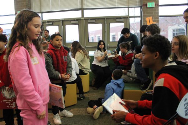 On Feb. 10th junior Damon Campbell and his group are meeting with the fifth graders at Bell Prairie elementary school for the first time. They were reading the potential stories that will be brought life by the Creative design class. Campbell said, " nfdbjnrdfknbojdnr."