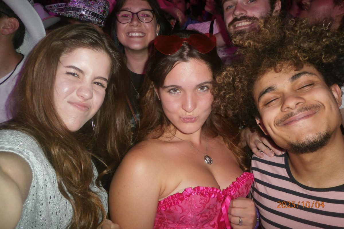 Charlotte Conway Colthup (center) making friends Xavier and Clay at the Chappell Roan concert at the Liberty Memorial in Kansas City, Missouri, Oct. 4.
