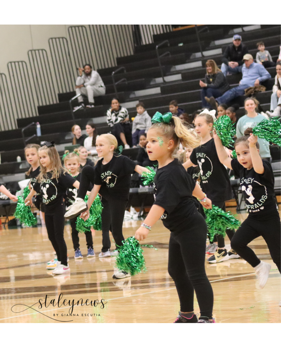 Tiny Emeralds Dance At Basketball Game