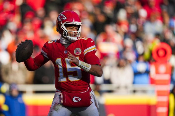 Dec 14, 2025; Kansas City, Missouri, USA; Kansas City Chiefs quarterback Patrick Mahomes (15) looks to pass against the Los Angeles Chargers during the second quarter at GEHA Field at Arrowhead Stadium. Mandatory Credit: Jay Biggerstaff-Imagn Images