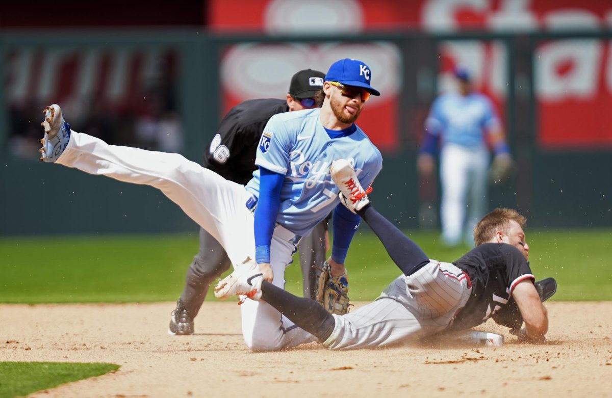 Apr 2, 2026; Kansas City, Missouri, USA; Minnesota Twins second baseman Kody Clemens (2) is tagged out at second base by Kansas City Royals shortstop Bobby Witt Jr. (7) during the fifth inning at Kauffman Stadium. Mandatory Credit: Jay Biggerstaff-Imagn Images